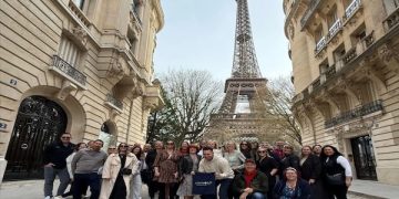 Traveling Advisors are present at the luxury cruise display.
Paris